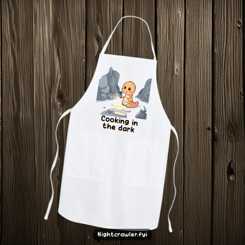 Funny apron featuring an earthworm holding a flashlight to light a dark path, designed for kitchen tasks with a humorous and inspiring touch.