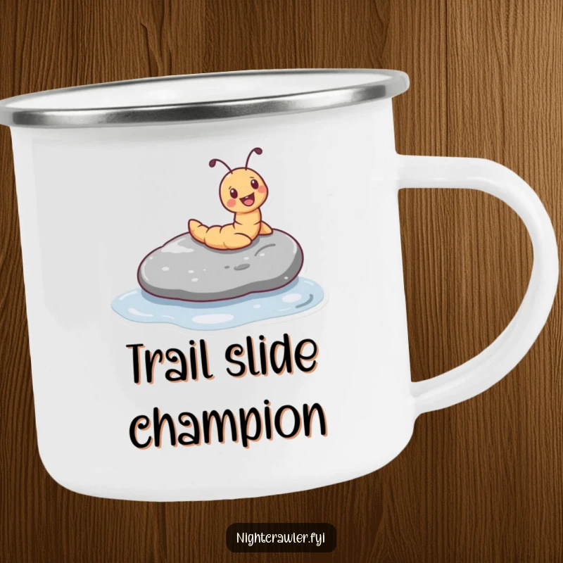 Funny camping mug showing a tiny worm character joyfully sliding down a smooth, wet pebble, perfect for outdoor enthusiasts.