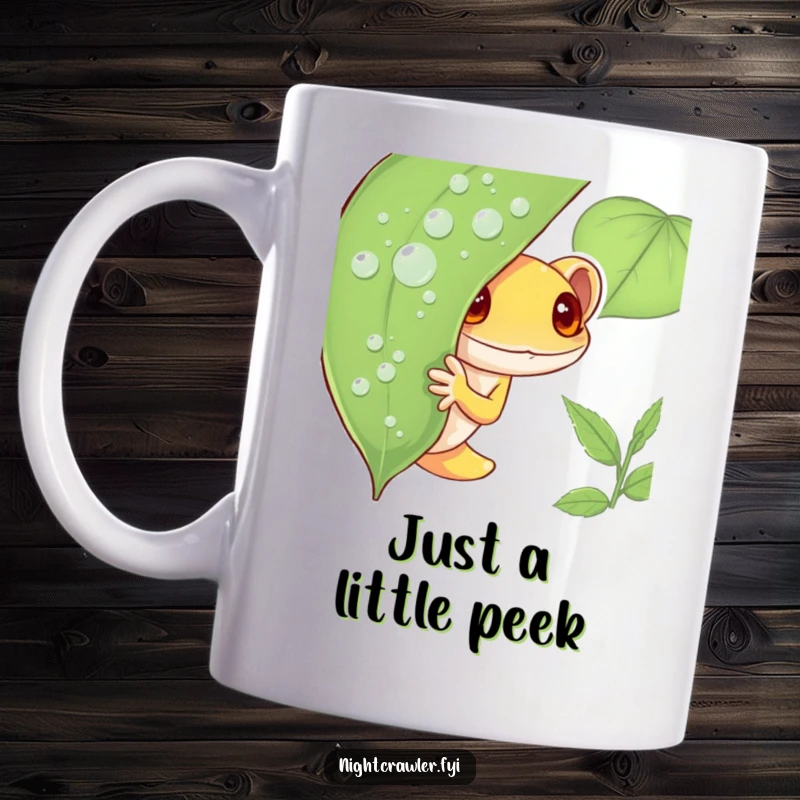Funny Gecko Mug featuring a shy gecko character cautiously peeking from behind a glistening dew-covered leaf, conveying adorable bashfulness for tea or coffee lovers.