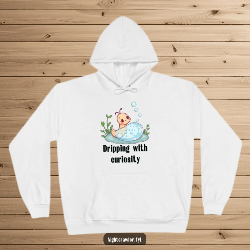 Funny hoodie featuring a curious earthworm exploring a giant dewdrop, designed for warmth and inspiring a sense of wonder.
