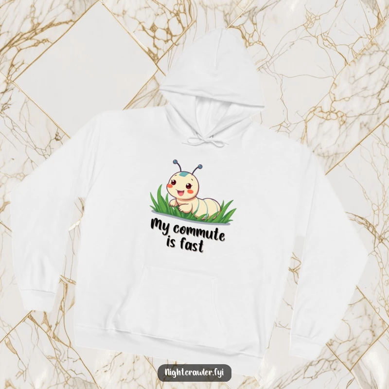 Funny hoodie featuring a cheerful night crawler sliding down a dewy blade of grass, perfect for staying warm and amused.