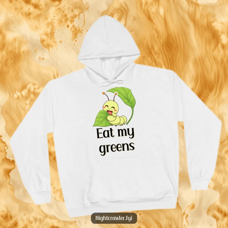 Funny caterpillar hoodie showing a happy character joyfully eating a large leaf, embodying comfort and contentment.
