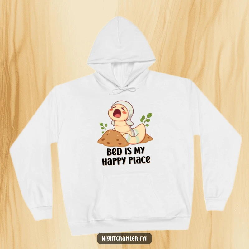 Funny Earthworm Pajama Hoodie: Cozy sleepy worm in pajamas peeking from soil with a yawn, ideal for gifting.