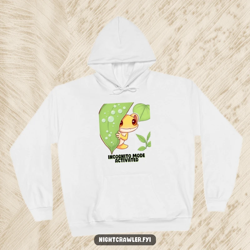 Funny Gecko Hoodie featuring a shy gecko character peeking out from behind a dew-covered leaf, offering a humorous and cozy design for chilly days.