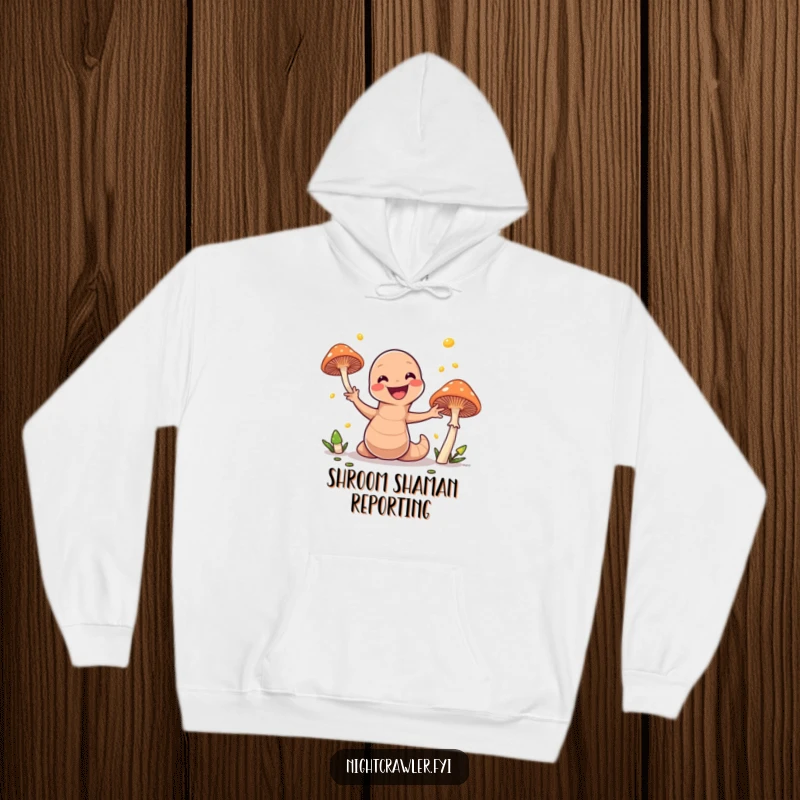 Funny hoodie depicting an energetic earthworm masterfully juggling brightly glowing mushrooms, bringing a magical and humorous vibe.