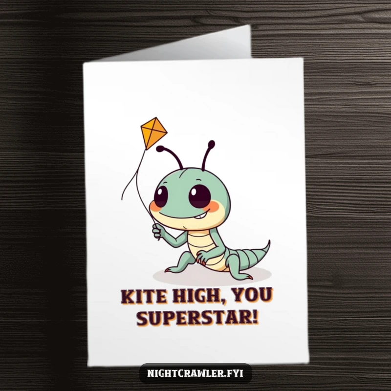 Funny Free Printable Congrats Card: Night crawler with a goofy grin tries to get a tiny kite airborne, full of hopeful effort.