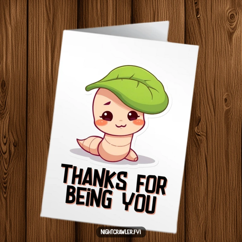 Funny Free Printable Thank You Card: Worm character with a mischievous smirk, peeking out from under a leaf, sending thanks.