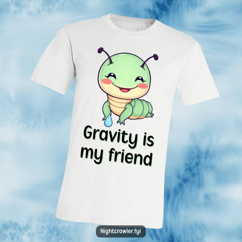 Funny t-shirt featuring a round, cute night crawler character cheerfully sliding down a large dewdrop, wearing a big, goofy grin.