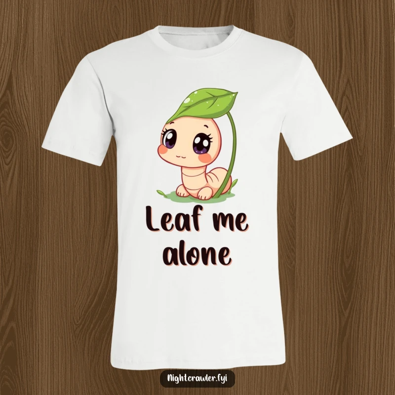 Funny t-shirt featuring a cute worm character peeking from a dewy leaf with wide, curious eyes, representing funny wonder and the magic of small things.