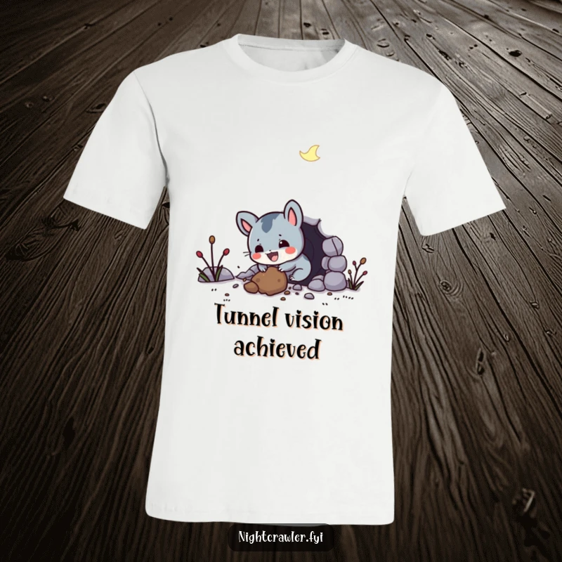 Funny t-shirt with a small, happy night creature digging a tunnel with immense glee, representing a love for adventure and discovery.