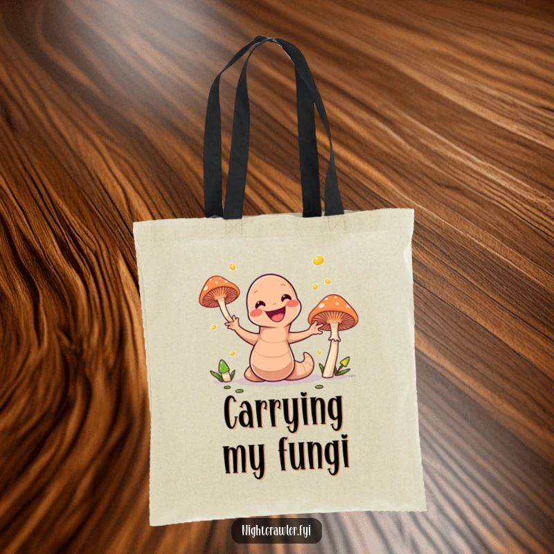 Funny tote bag with a playful earthworm artistically juggling radiant mushrooms, perfect for carrying groceries or treasures with a humorous touch.